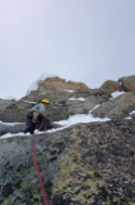 Climbing the slab to retrieve the rope